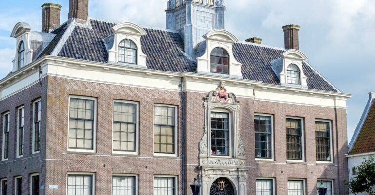People waiting with documents in a bright Dutch city hall