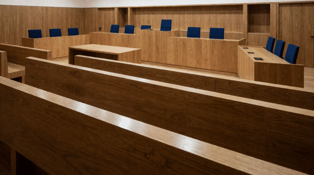 Empty courtroom with oak benches and the judges' bench
