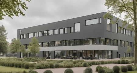 Modern building surrounded by landscaped gardens.