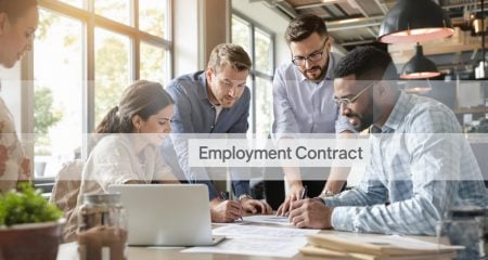 Dutch office scene with manager and employees signing employment contract